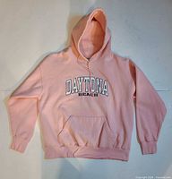 Front of pink Daytona Beach hoodie showing graphic and pocket