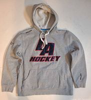 Front view showing overall hoodie design, BA Hockey graphic, drawstrings, pocket