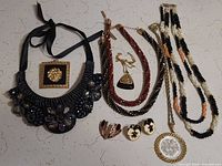 Group shot showing all eight jewelry pieces together