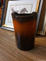 Front view of brown to amber Canadian pottery vase