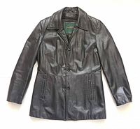 Front view of black leather Danier jacket showing buttons, collar and pockets