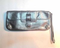 Front view of leather wristlet showing buckle detail and wrist strap