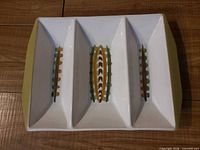 Top view of Denby divided snack tray showing three compartments and pattern