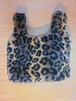 Front view of leopard faux fur handbag