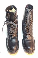 Front view of pair showing laces and embossing