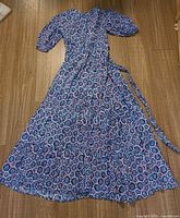 Full view of Hatley blue floral wrap dress with waist tie extended