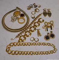 All jewelry pieces laid out on surface