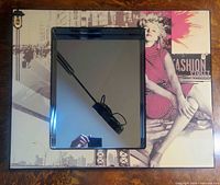 Front view of mirror showing artwork and square mirror inset