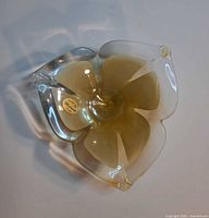 Top view showing flower shape, coloration, Murano sticker