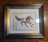 Full view of framed horse painting