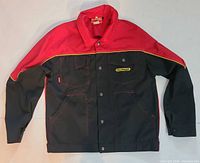 Front view of black and red Palfinger work jacket showing snap closure, pockets, logo