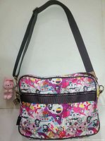 Full view of Tokidoki messenger bag with attached pink plush