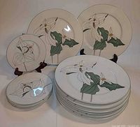 Front view showing stacks and display of dinner and side plates with trillium pattern
