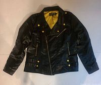 Front view showing overall design, gold buttons, asymmetric zipper, and chartreuse lining