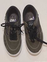 Pair of Vans shoes top view showing uppers, laces and insoles
