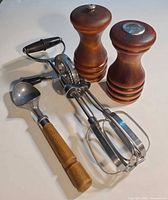 Full lot showing salt & pepper mills, egg beater, ice cream scoop