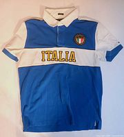 Front view showing ITALIA lettering and overall color scheme