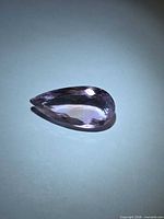 Overall view of pear-cut Ametrine showing face-up colour and facets