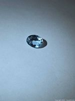 Loose oval aquamarine on neutral background