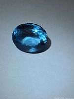 Front angled view showing vivid blue color and faceting
