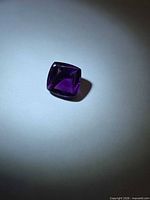 Square cushion sugarloaf amethyst on neutral background showing overall shape and color