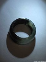 Full view of jade ring showing band thickness and color