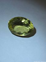 Top view of oval lemon citrine showing facets and color