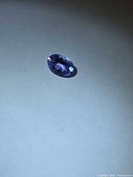 Top view of single oval-cut violet-blue tanzanite
