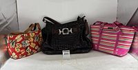 Three handbags: Kimberly red flip-flop print, Brighton black croc-embossed, Kate Spade striped tote