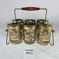 Front view showing six Cera world map shot glasses in metal carrier