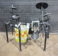 full view of Alesis electronic drum kit on rack