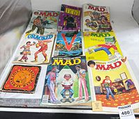 Front covers of nine items laid out