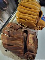 Overview of both gloves, brown and tan models side by side