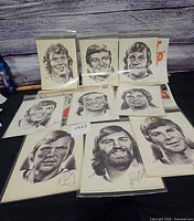 Group shot of ten 1970s Philadelphia Flyers player portrait prints in plastic sleeves