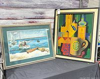 Both framed prints side by side for scale and comparison