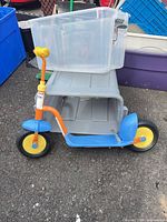 Full side view of vintage tri-wheel scooter showing deck, handlebar, wheels and condition