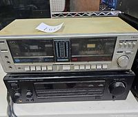 Front view of stacked Kenwood receiver and silver dual cassette deck