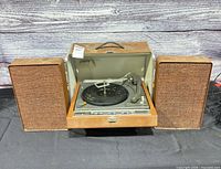 Record player with both speakers attached, lid open