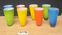 Front view of all eight coloured tumblers