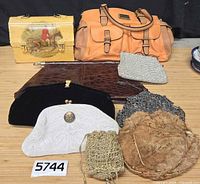 Group photo showing all nine purses and clutches laid out