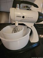 Sunbeam Mixmaster mixer with two white bowls attached