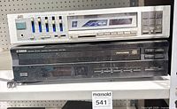 Front view showing full JVC receiver controls and Yamaha CD player model number