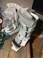 Two Aircast walking boots with straps visible on tabletop