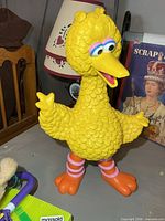 Front view of yellow resin Big Bird figure on table
