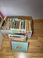 Overall view of box and separate stack showing quantity and variety