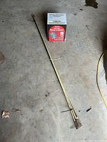 Brush box and four rods on floor