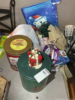 Overview showing tins, gift bag, string lights and other decorations