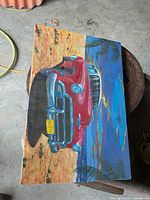 Full view of entire 24" x 16" oil on canvas painting showing red vintage car on beach scene