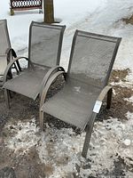 Front view of both chairs on snowy ground