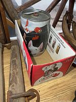 Mini keg inside cardboard case showing artwork